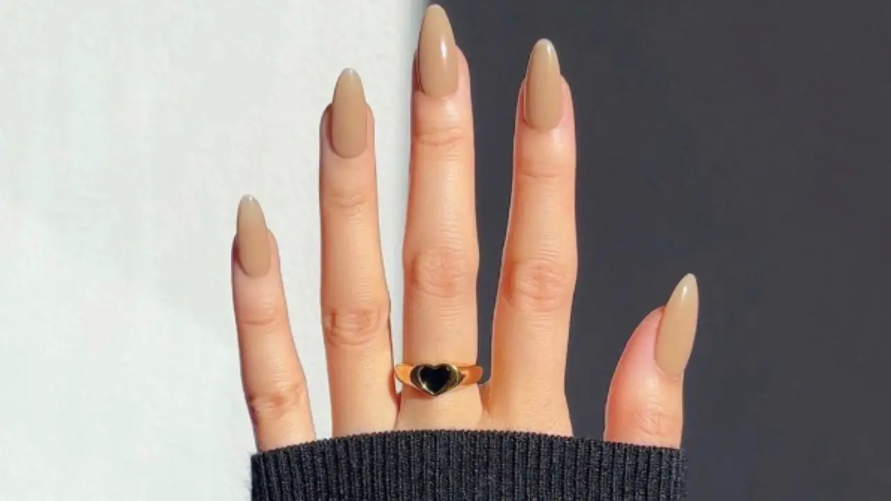 Chic And Sophisticated Nude Or Neutral Nails With A Black Dress