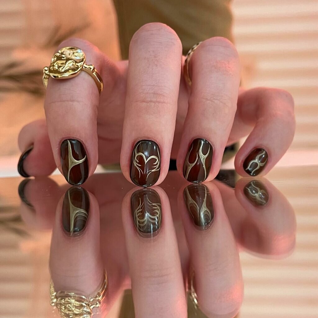 Abstract Gold Accented Nail Design